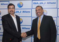 Kamesh Goyal, CEO, Bajaj Allianz Life Insurance and country manager Allianz, with Madhavan Menon, MD, Thomas Cook (India), Ltd